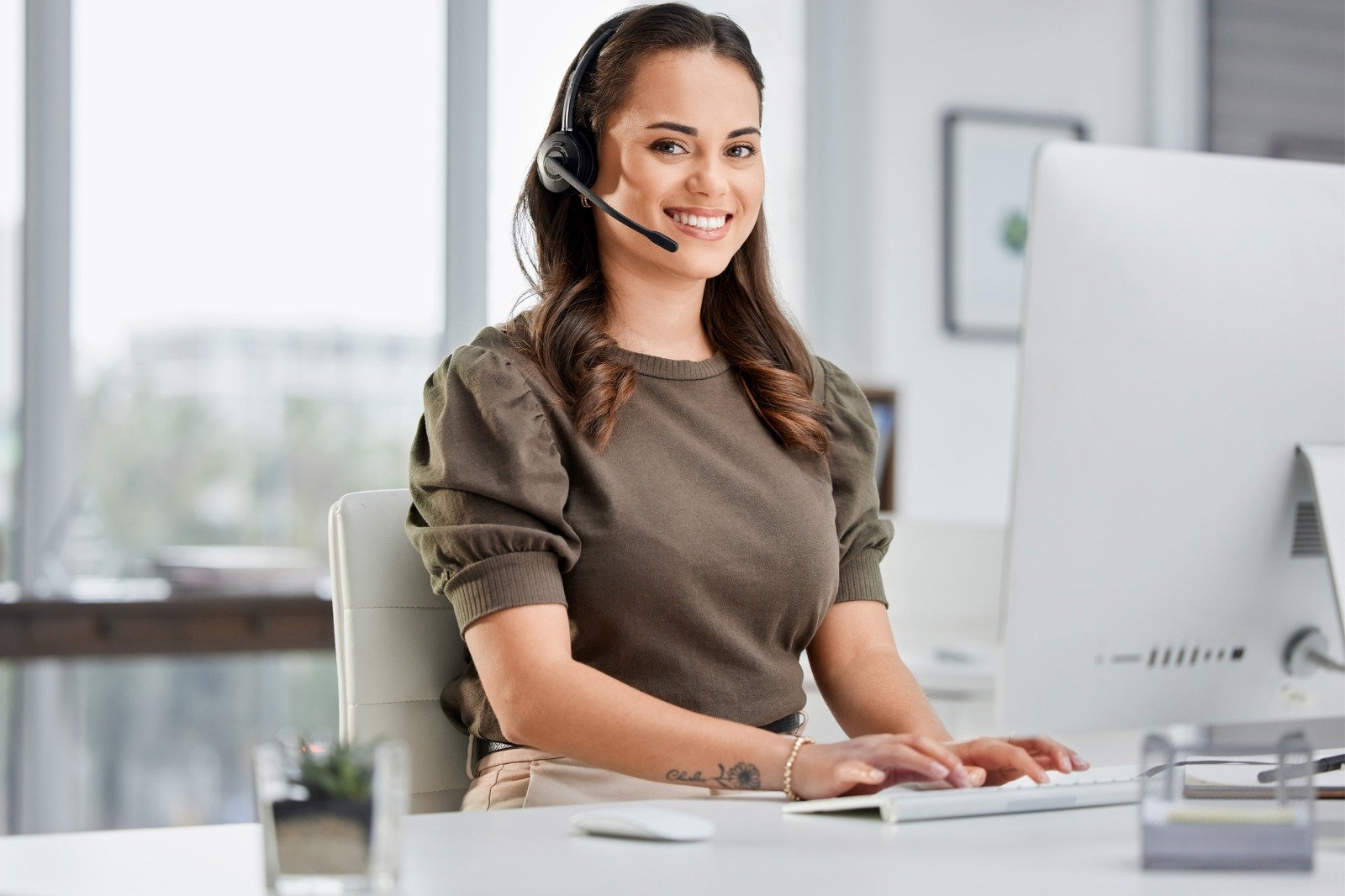 A data entry and support worker at a computer in a work-from-home role